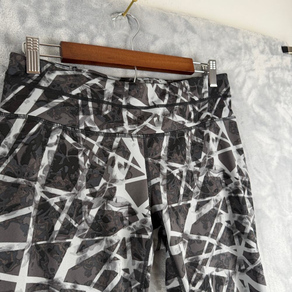 ATHLETA GEO SONAR LEGGING IN BLACK/SLATE GREY SZ Medium
